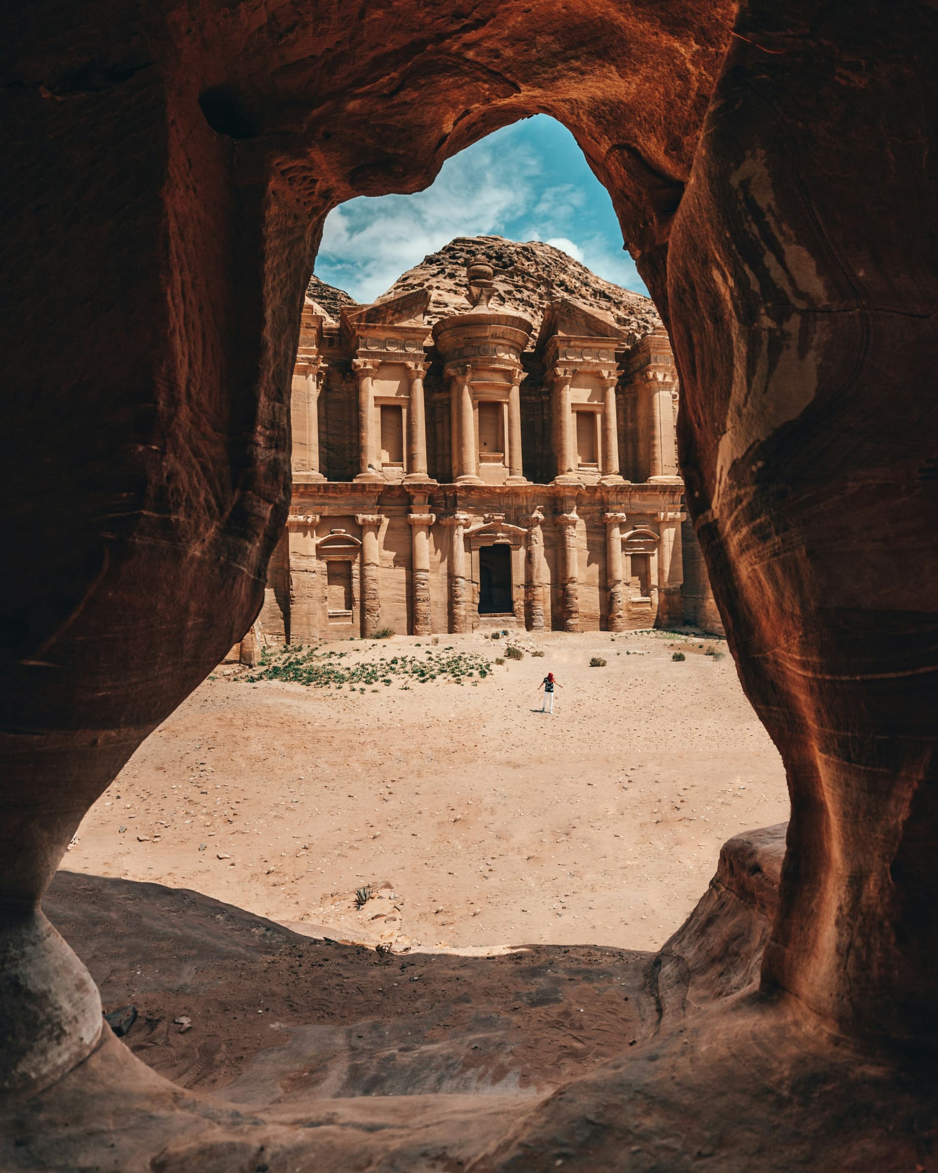 The view from inside a Petra cave looking out — calm light, framed depth